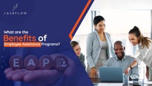 four diverse business professionals smiling , discussing about “EAP” and collaborating around a laptop in an office setting.